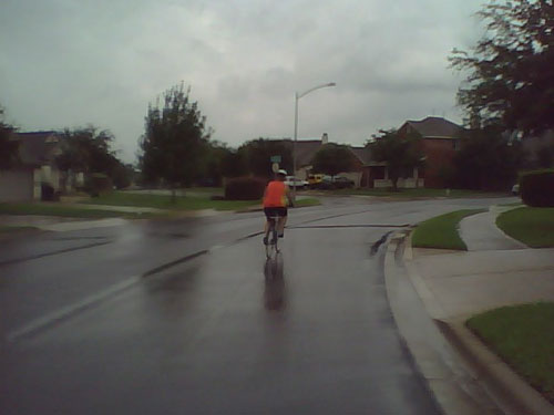 My wife negotiates a curve a few blocks from our house on a rainy day.