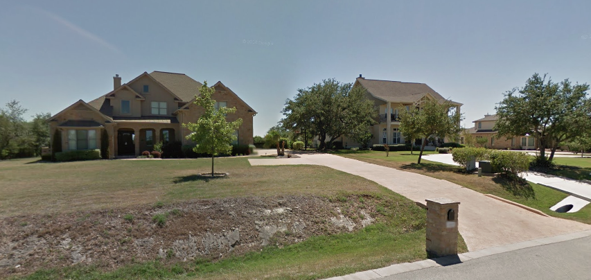The a couple of the "modest" houses on Blazyk Drive. (Picture from Google Streetview.) (Click pix to enlarge.)